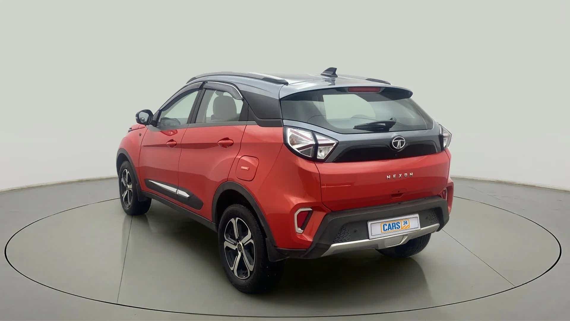Rear three-quarter view of a flame red Tata Nexon 2017-2023