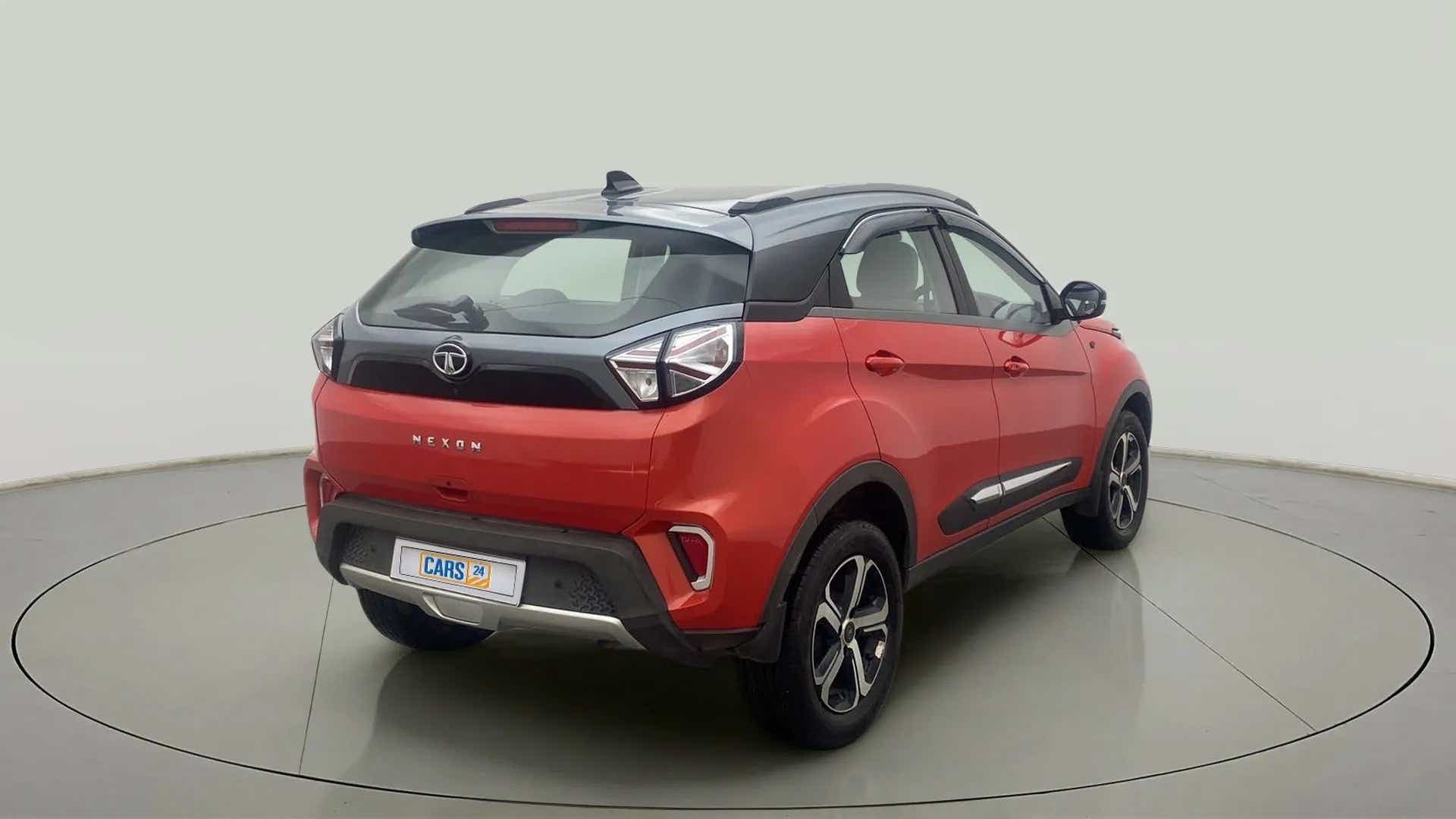 Rear three-quarter view of a Flame Red Tata Nexon 2017-2023