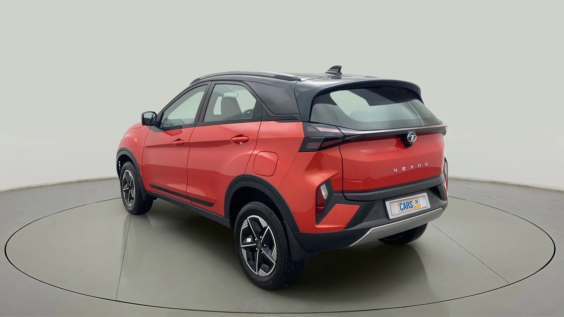 Rear three-quarter view of a Flame Red Tata Nexon 2017-2023