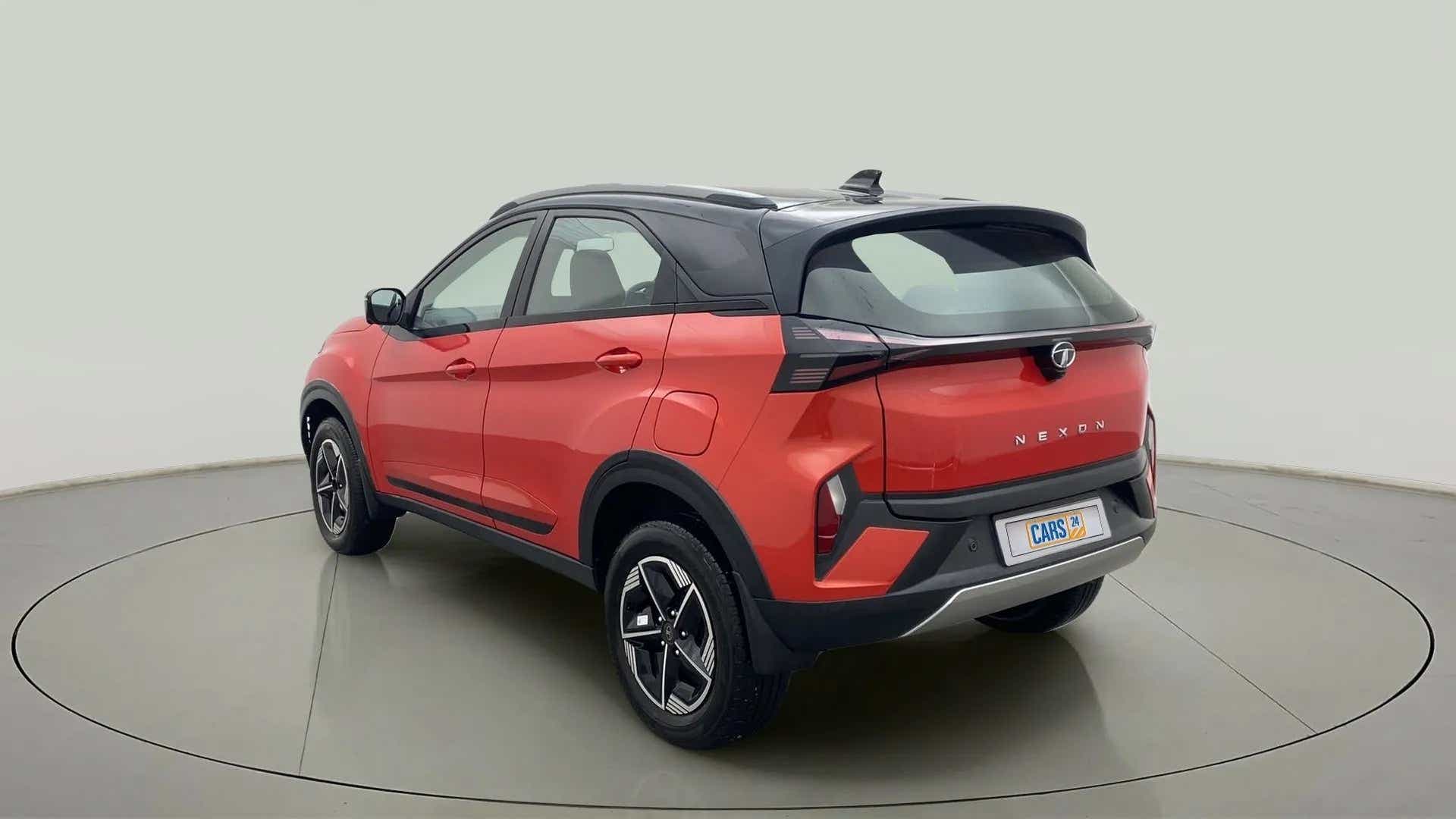 Rear three-quarter view of a Flame Red Tata Nexon 2017-2023