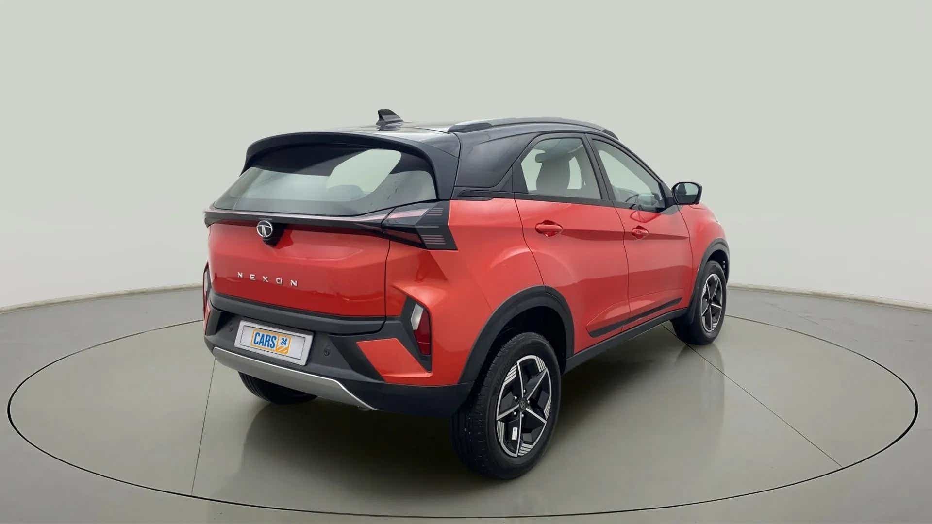 Rear three-quarter of a flame red Tata Nexon 2017-2023
