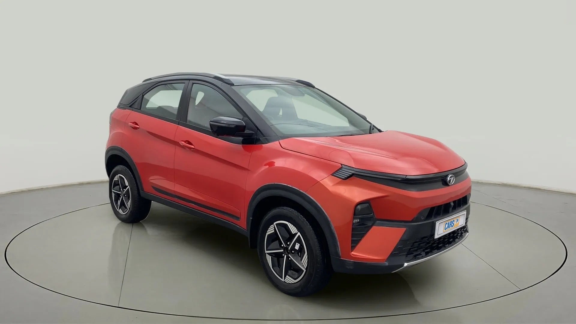 Front three-quarter view of a Flame Red Tata Nexon 2017-2023