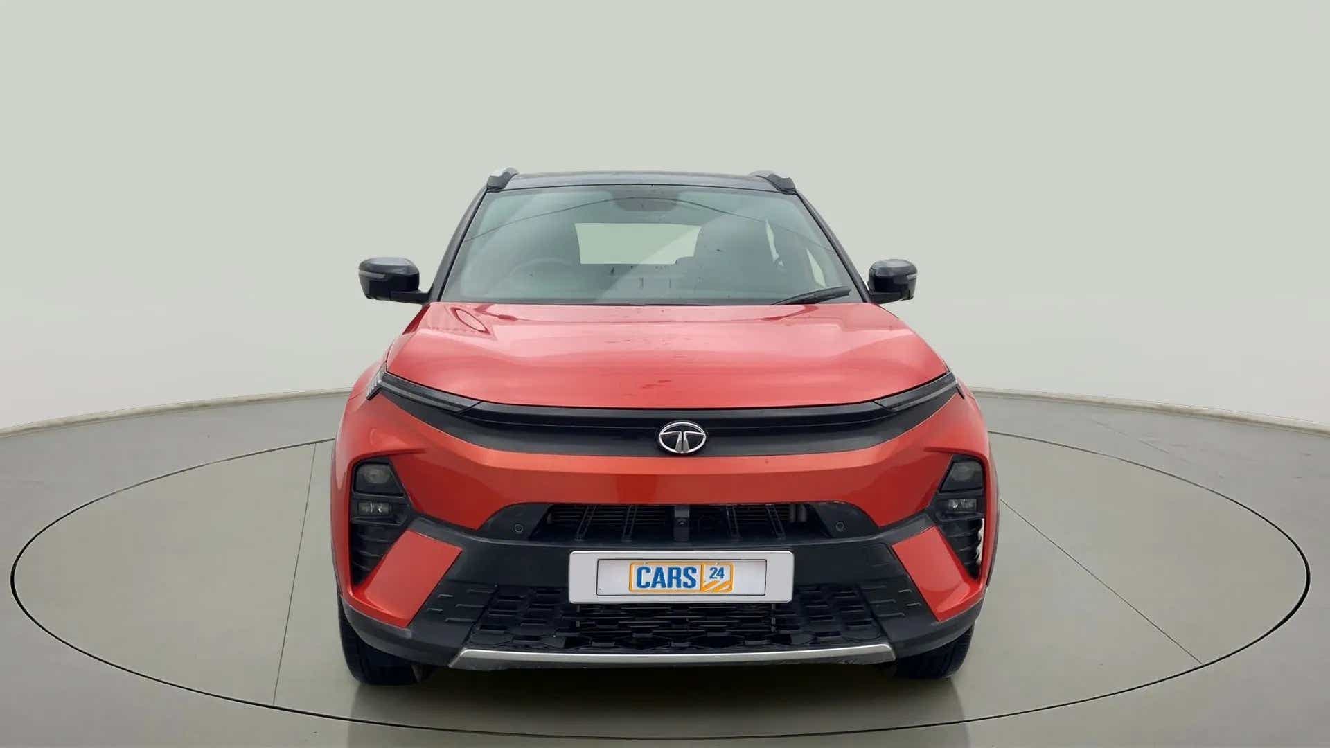 Front view of a flame red Tata Nexon 2017-2023