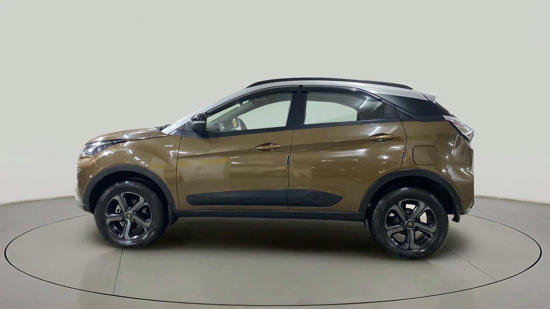 Side view of a Grassland Beige Tata Nexon 2017-2023