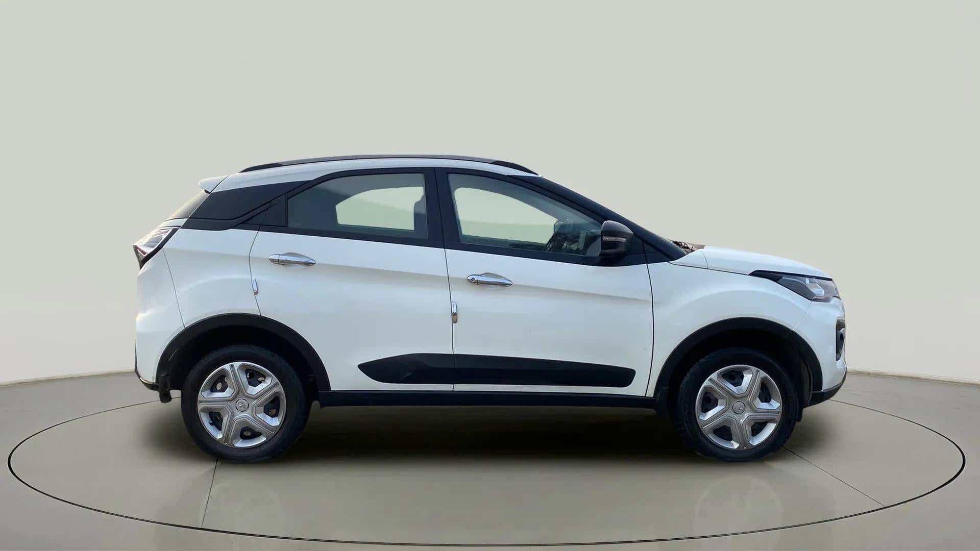 Side view of a calgary-white Tata Nexon 2017-2023