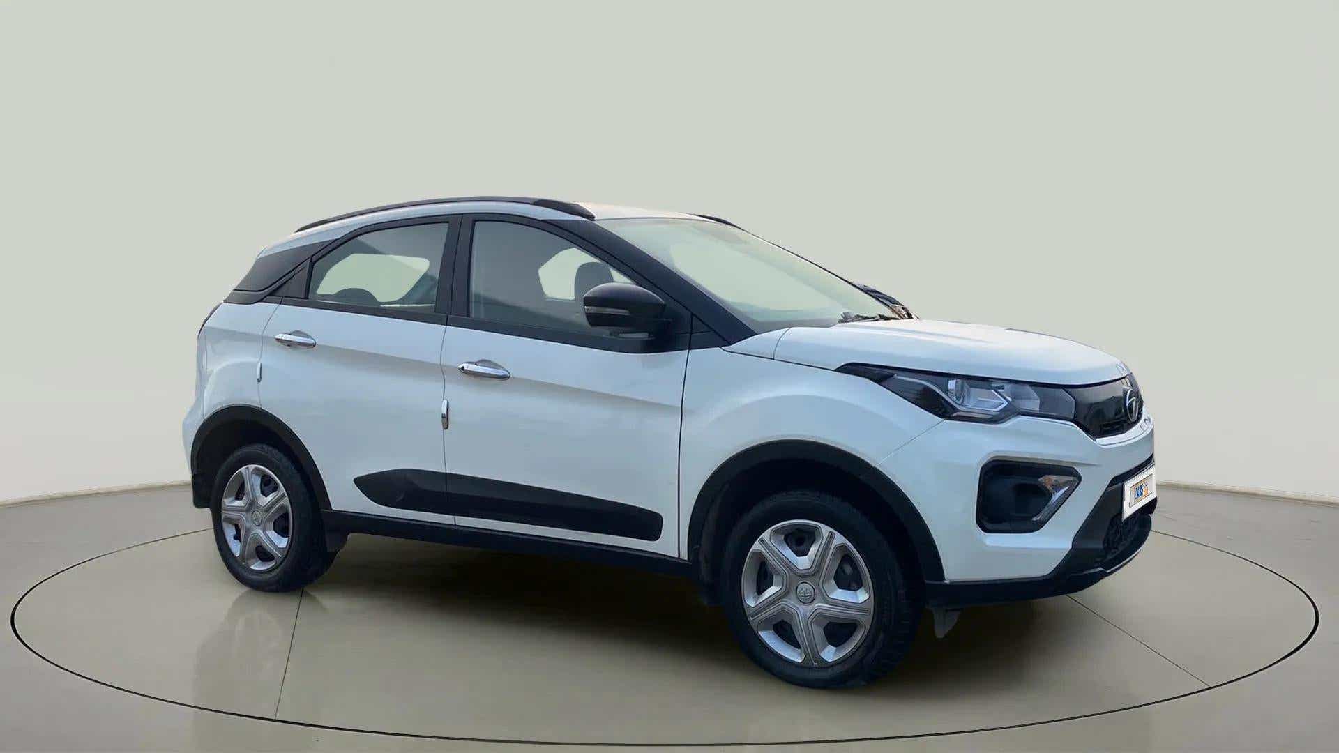 Front side view of a Calgary White Tata Nexon 2017-2023