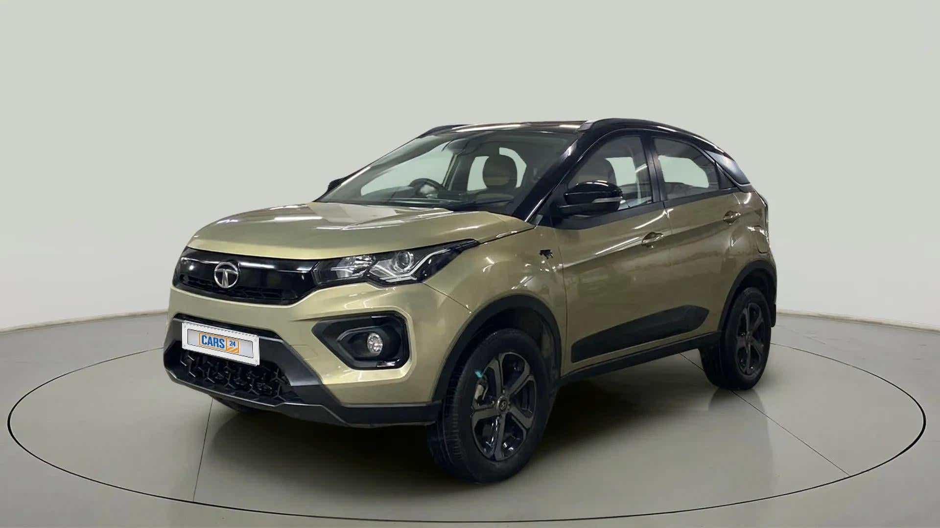 Front three-quarter view of a Grassland Beige Tata Nexon 2017-2023