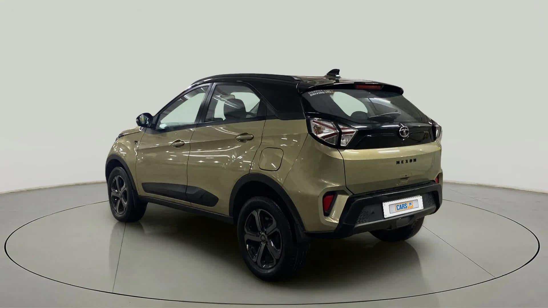 Rear three-quarter of a Grassland Beige Tata Nexon 2017-2023