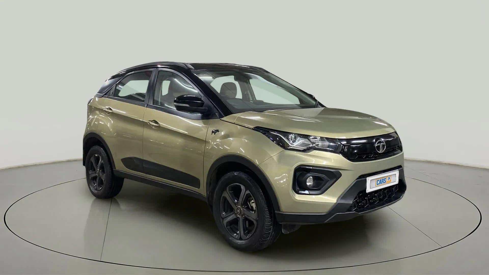 Front three-quarter view of a Grassland Beige Tata Nexon 2017-2023