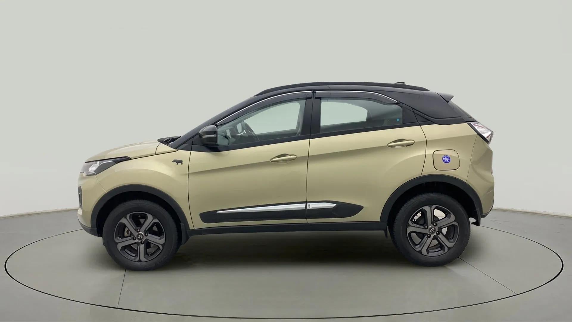 Side view of a Grassland Beige Tata Nexon 2017-2023