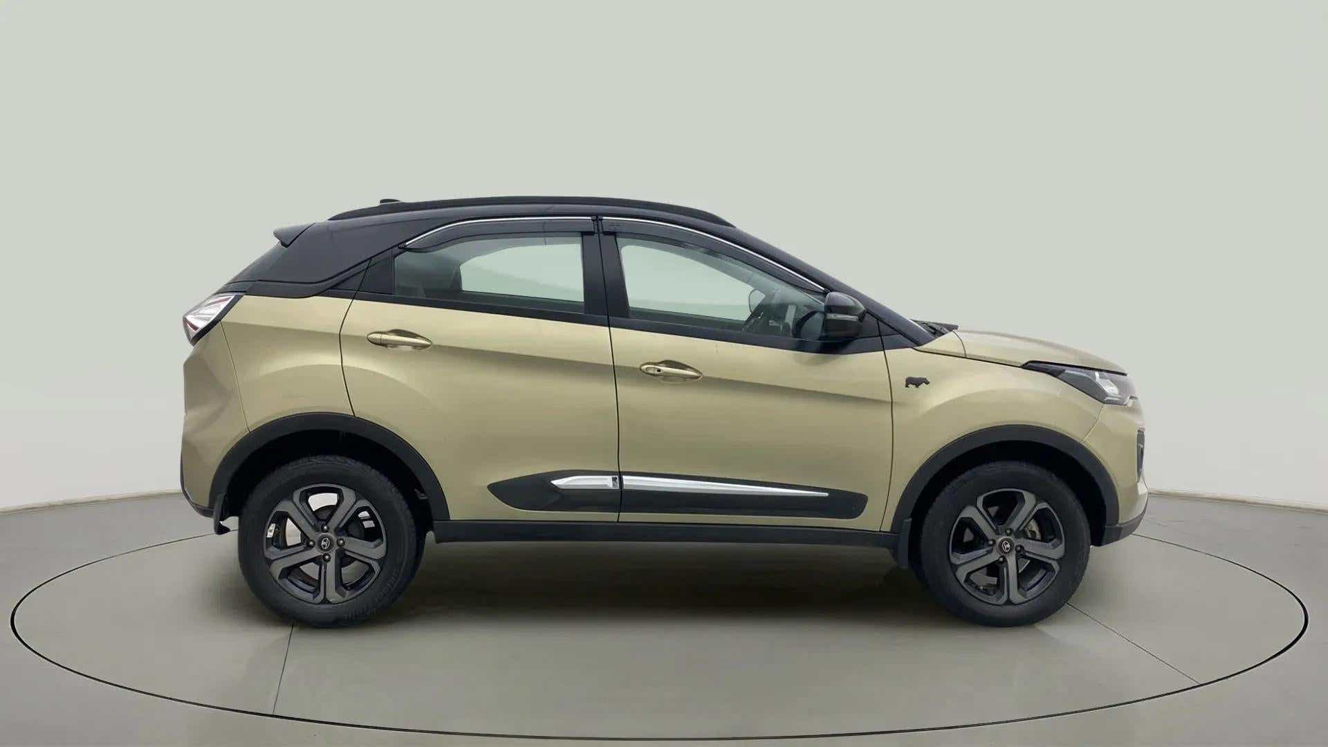 Side view of a Grassland Beige Tata Nexon 2017-2023