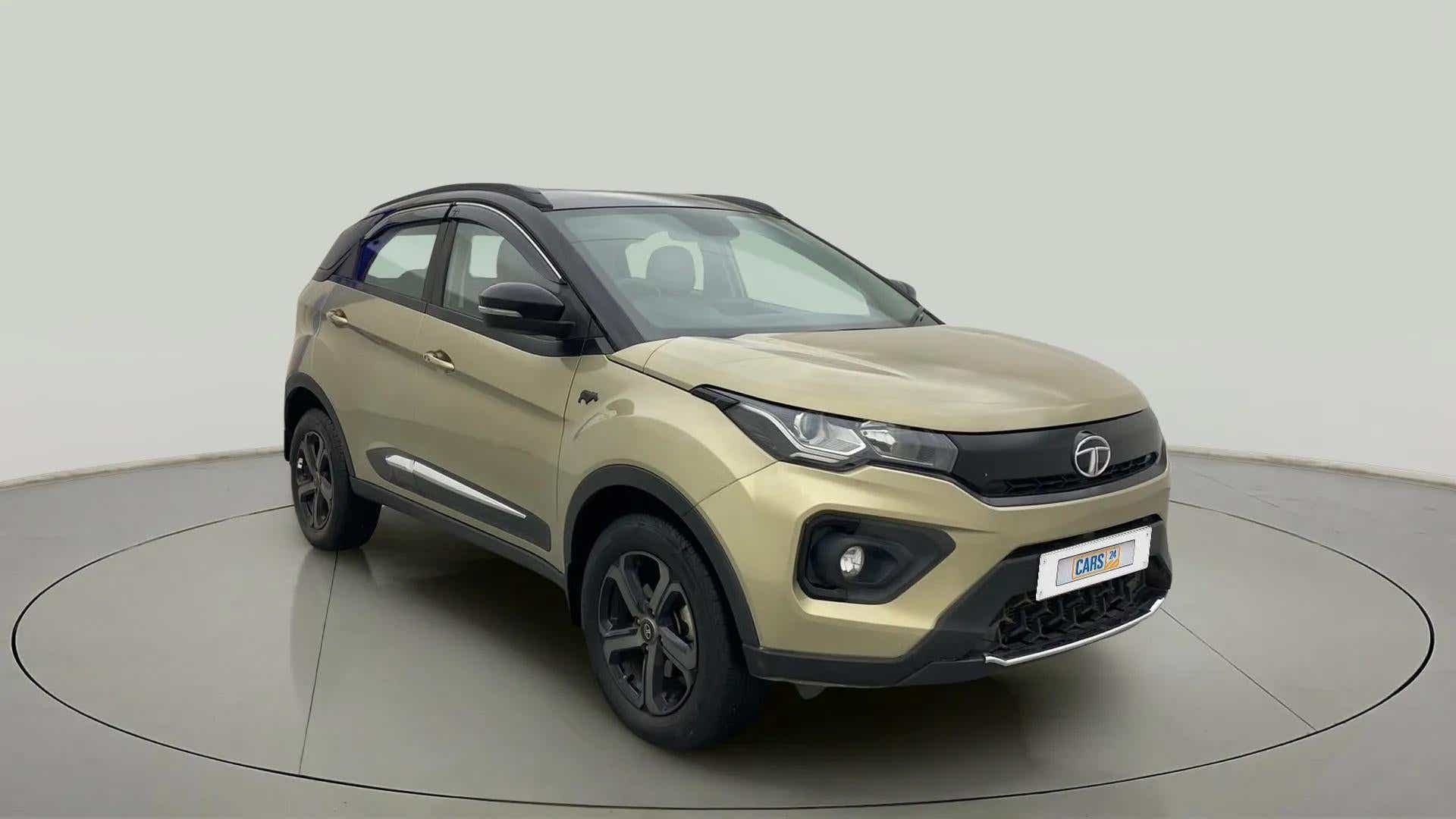 Front three-quarter view of a Grassland Beige Tata Nexon 2017-2023