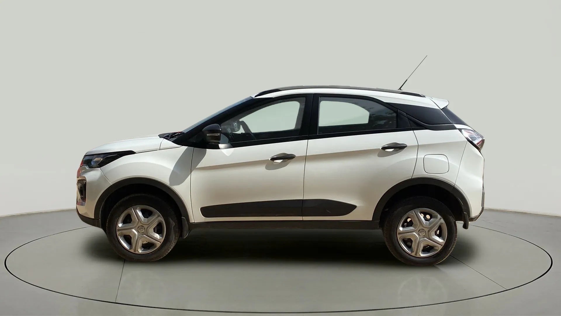 Side view of a Calgary White Tata Nexon 2017-2023