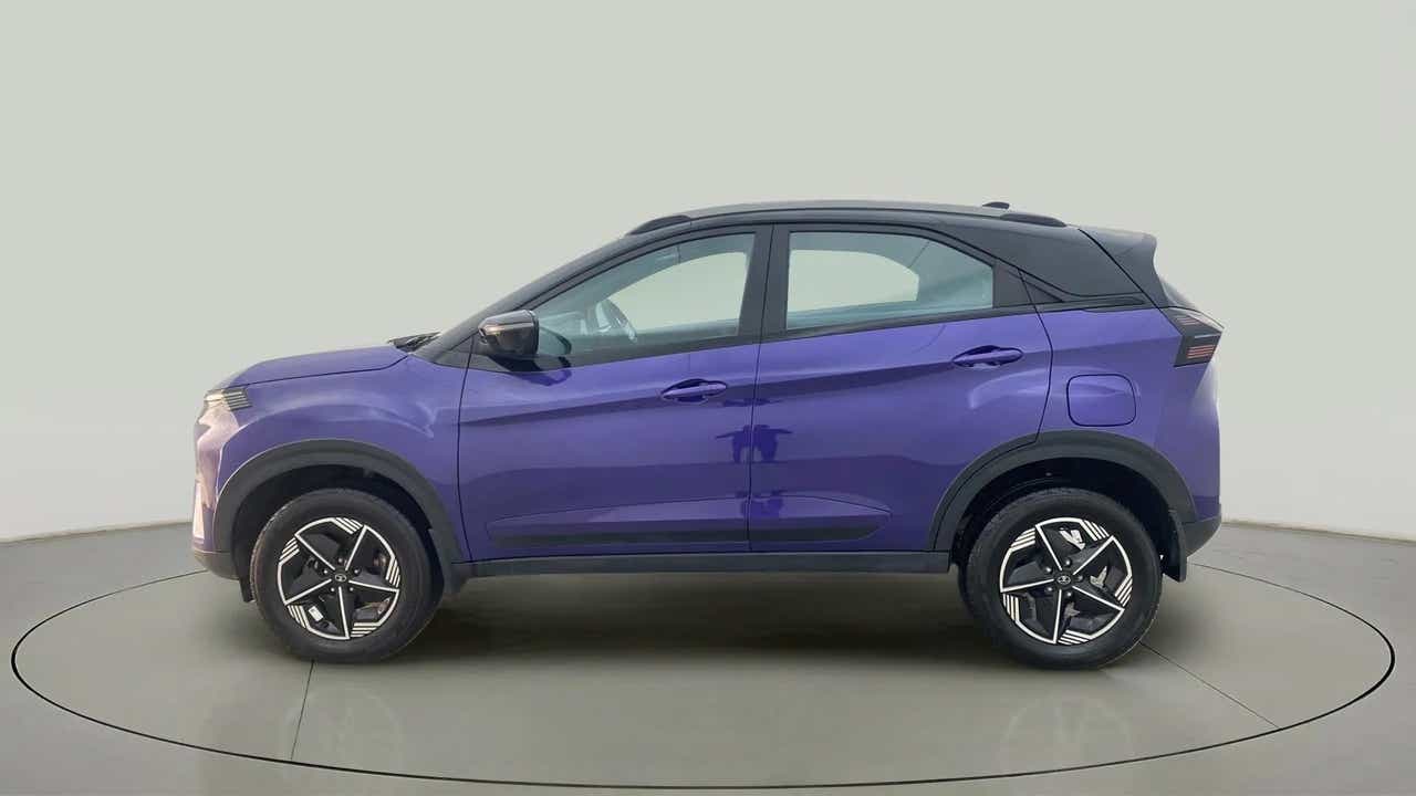 Side view of a royal blue Tata Nexon