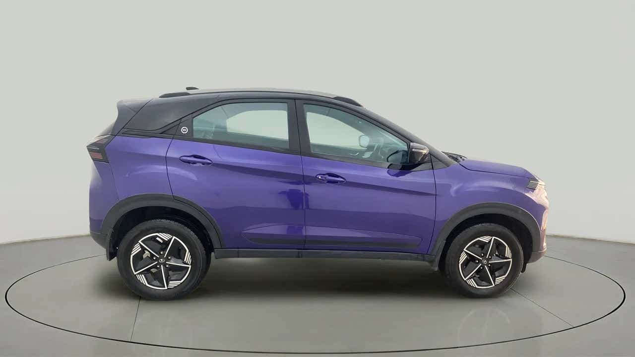 Side view of a royal blue Tata Nexon