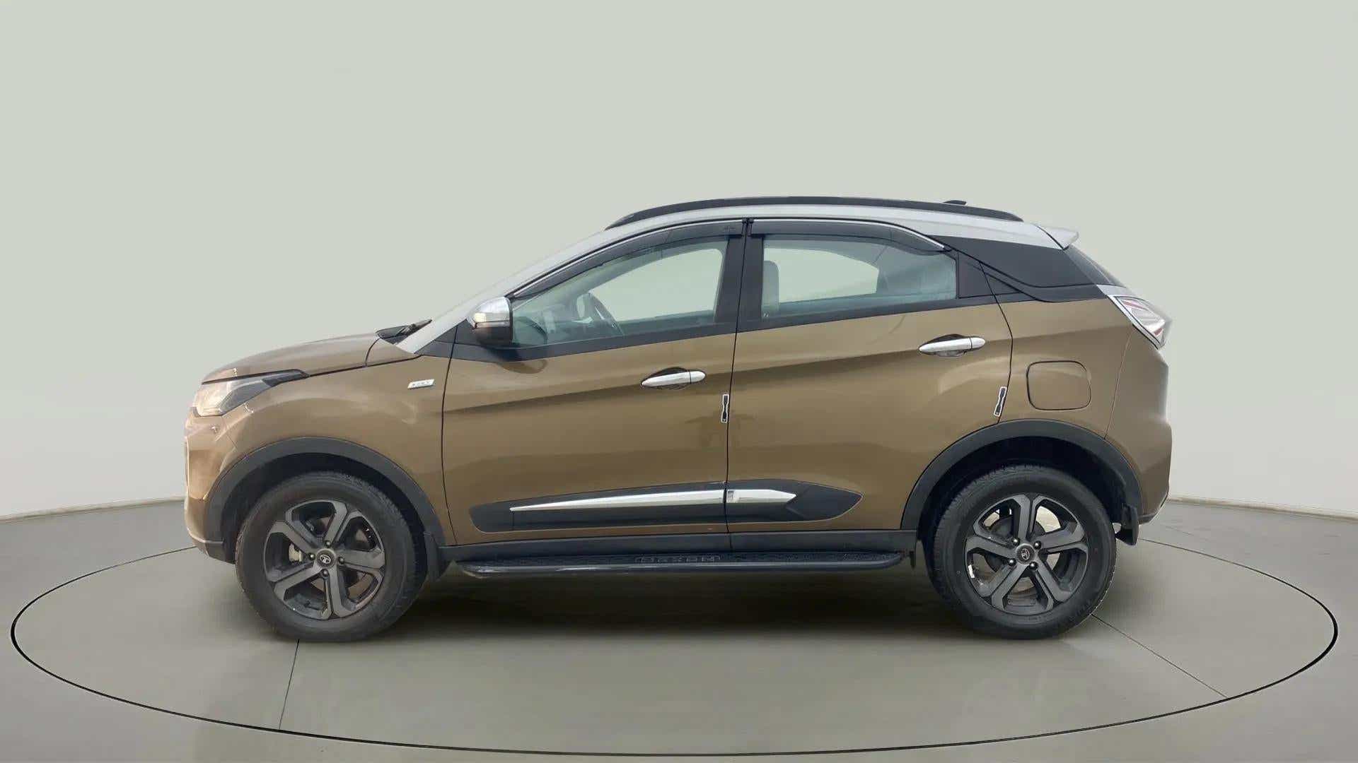 Side view of a Grassland Beige Tata Nexon 2017-2023