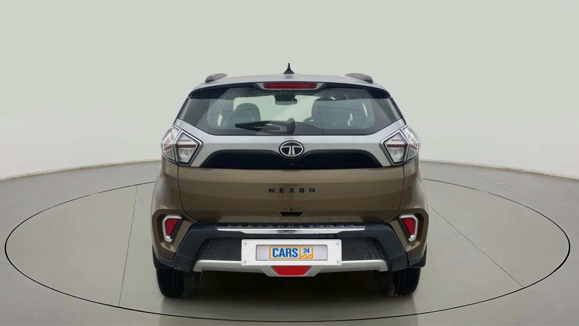Rear view of a Grassland Beige Tata Nexon 2017-2023
