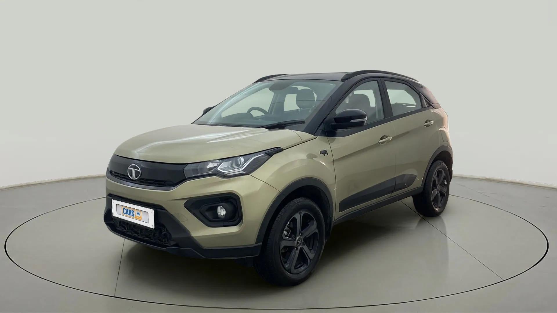 Front three-quarter view of a Grassland Beige Tata Nexon 2017-2023
