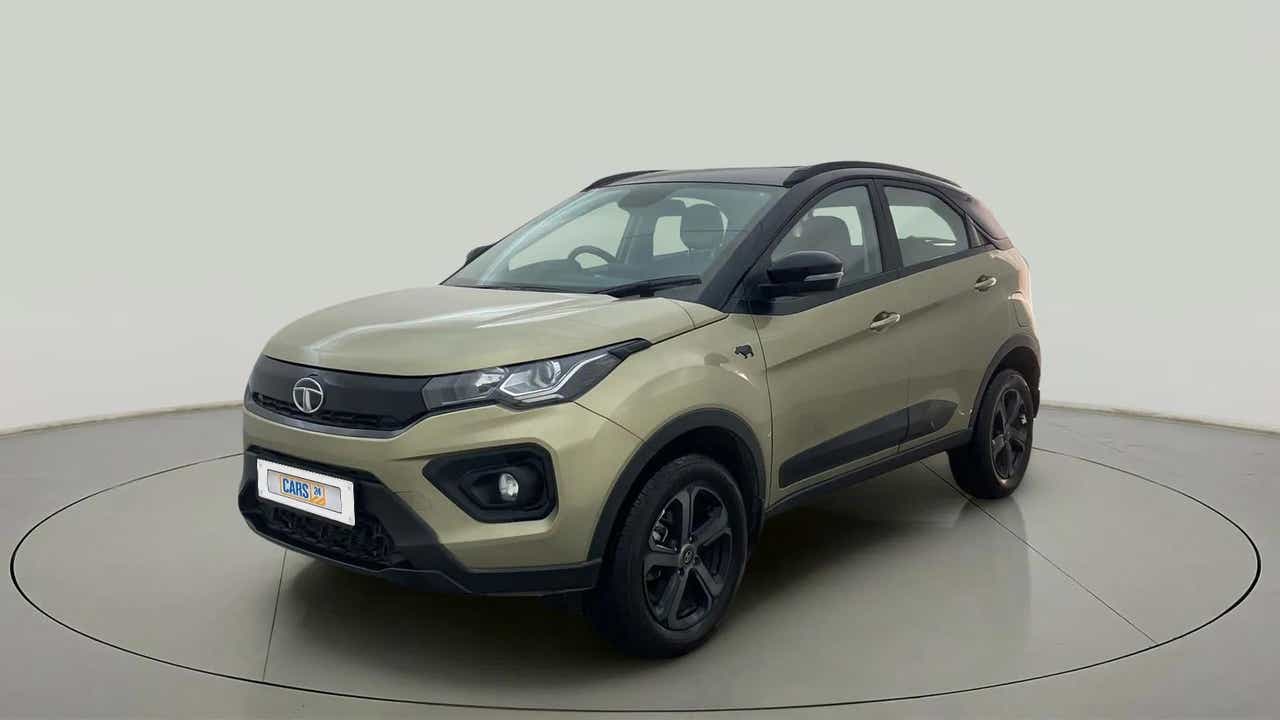 Front three-quarter view of a Grassland Beige Tata Nexon 2017-2023