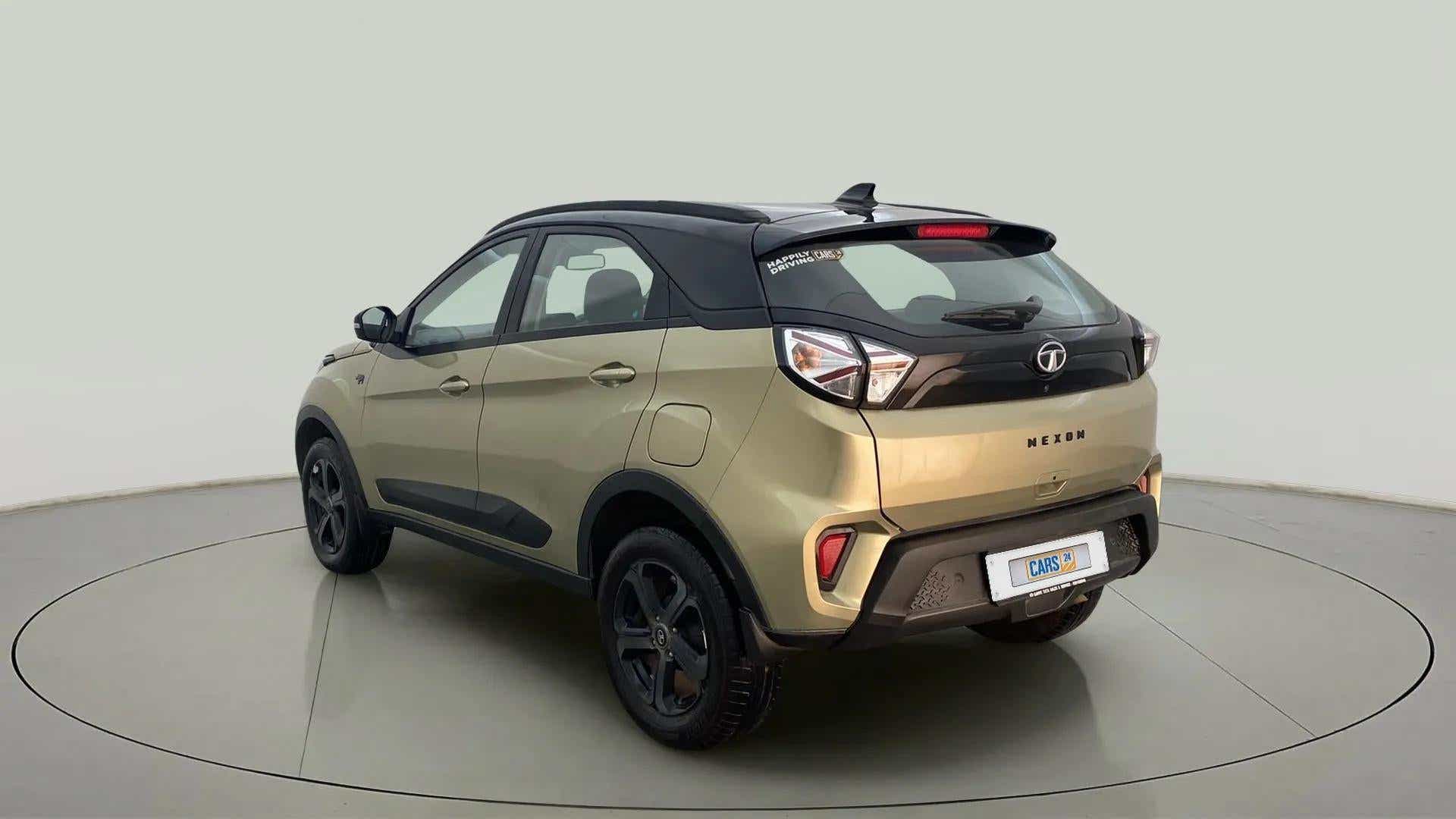 Rear three-quarter of a Grassland Beige Tata Nexon 2017-2023