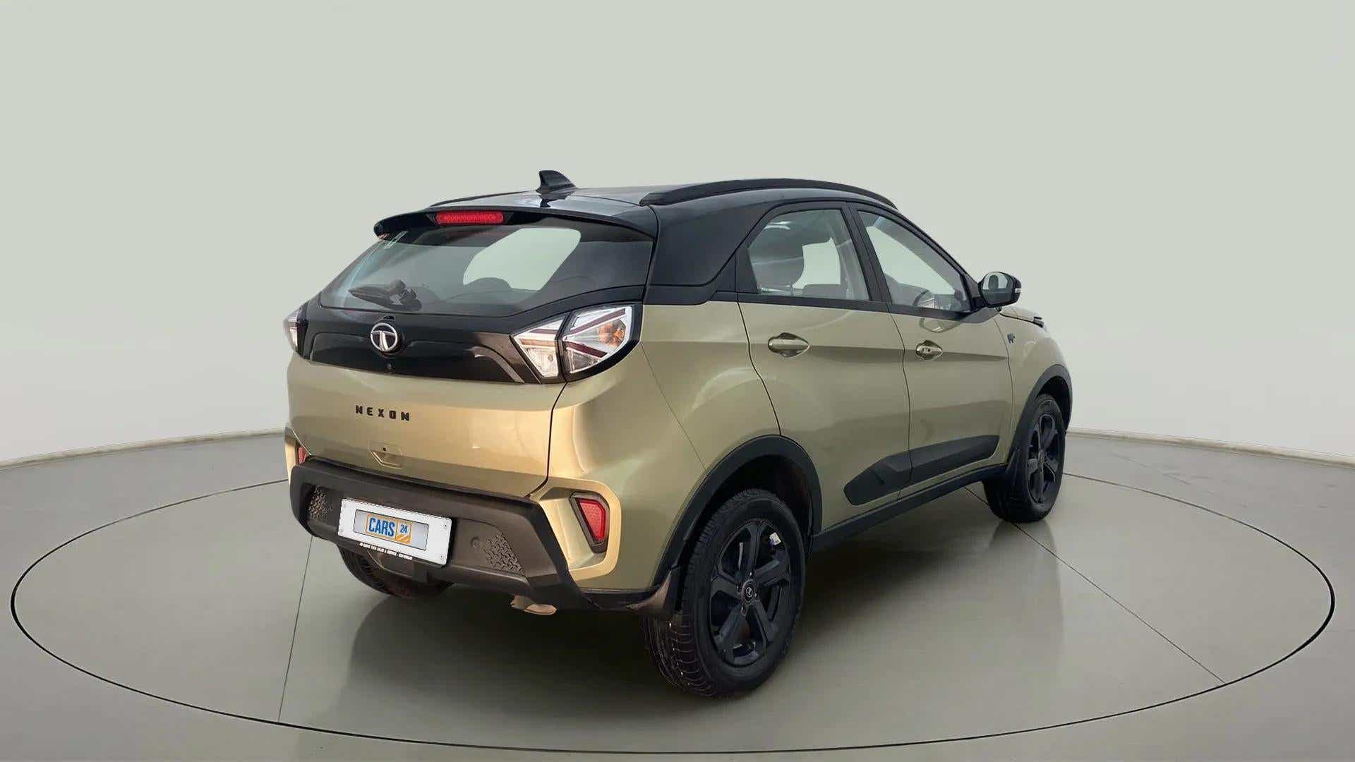 Rear three-quarter view of a Grassland Beige Tata Nexon 2017-2023