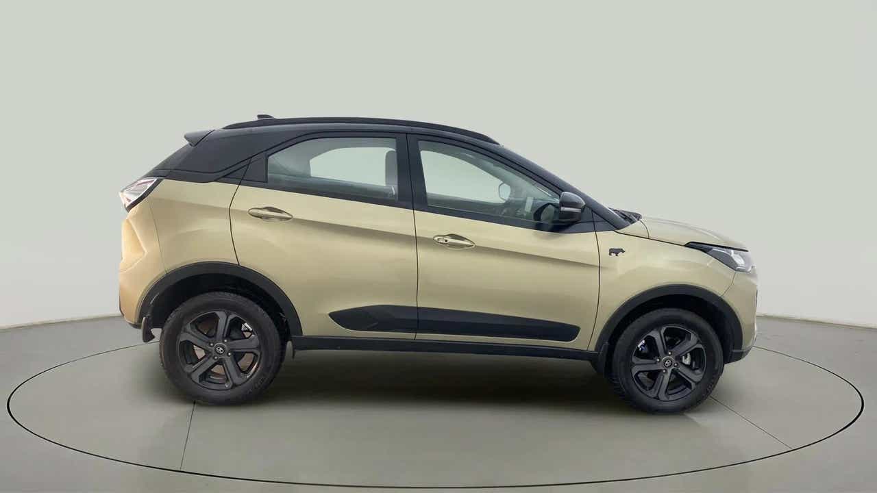 Side view of a Grassland Beige Tata Nexon 2017-2023