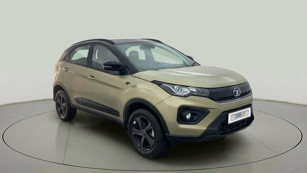 Front three-quarter view of a Grassland Beige Tata Nexon 2017-2023