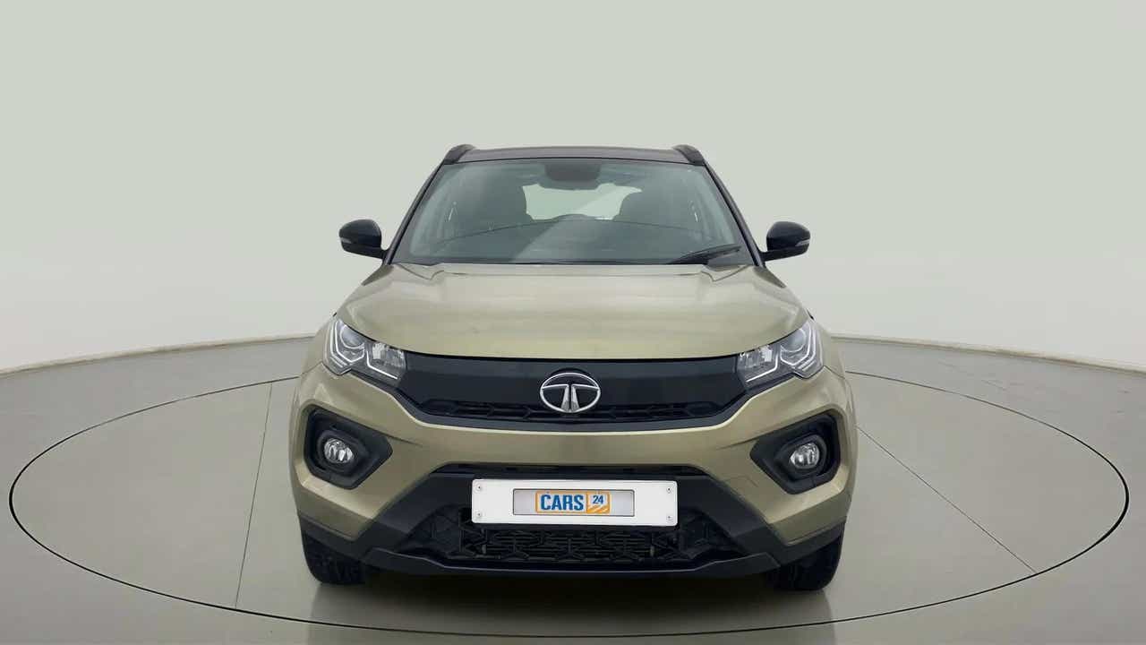 Front view of a Grassland Beige Tata Nexon 2017-2023