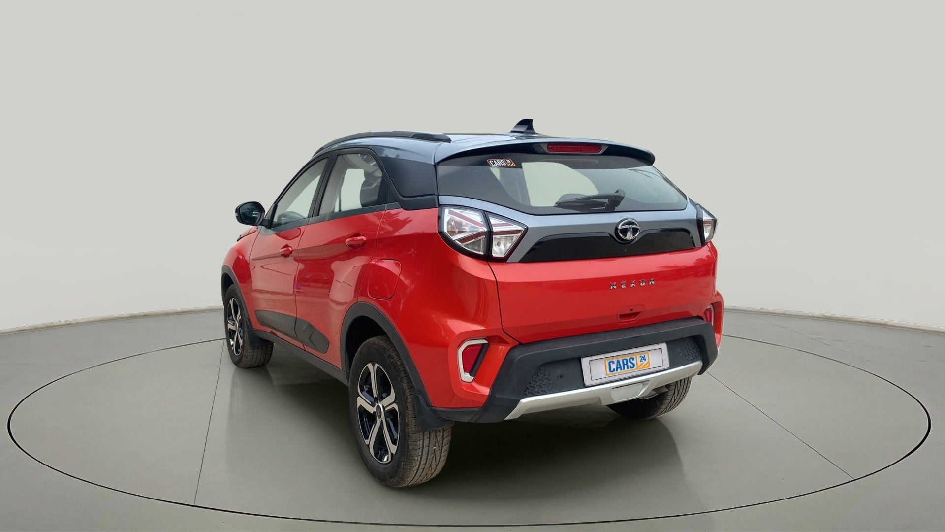 Rear three-quarter view of a Flame Red Tata Nexon 2017-2023