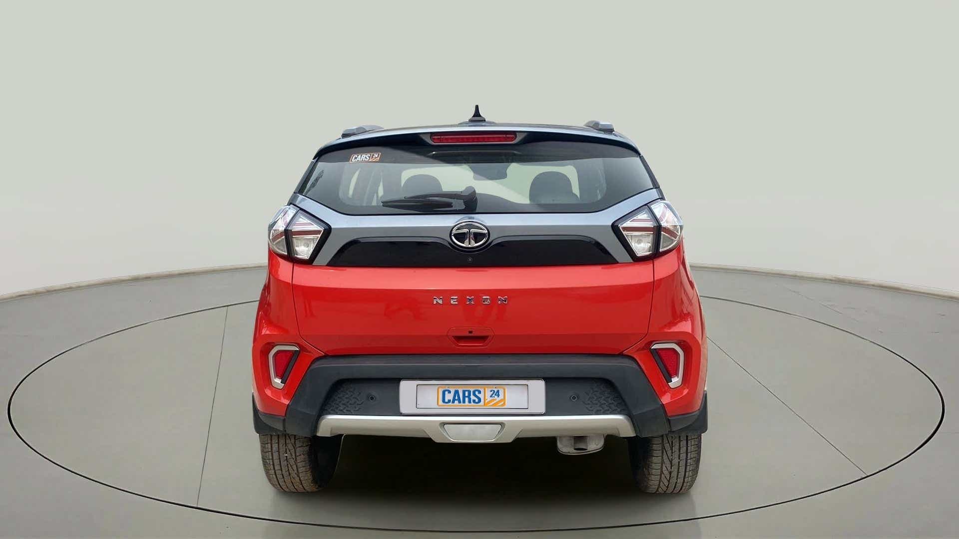 Rear view of a flame-red Tata Nexon 2017-2023