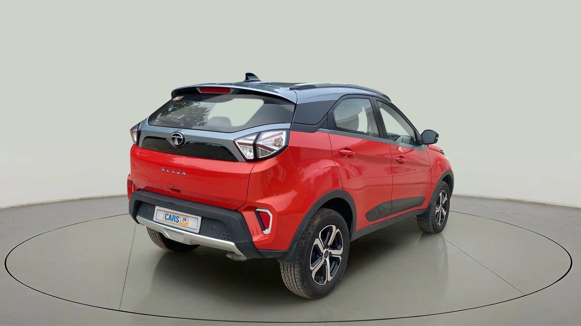 Rear three-quarter view of a Flame Red Tata Nexon 2017-2023
