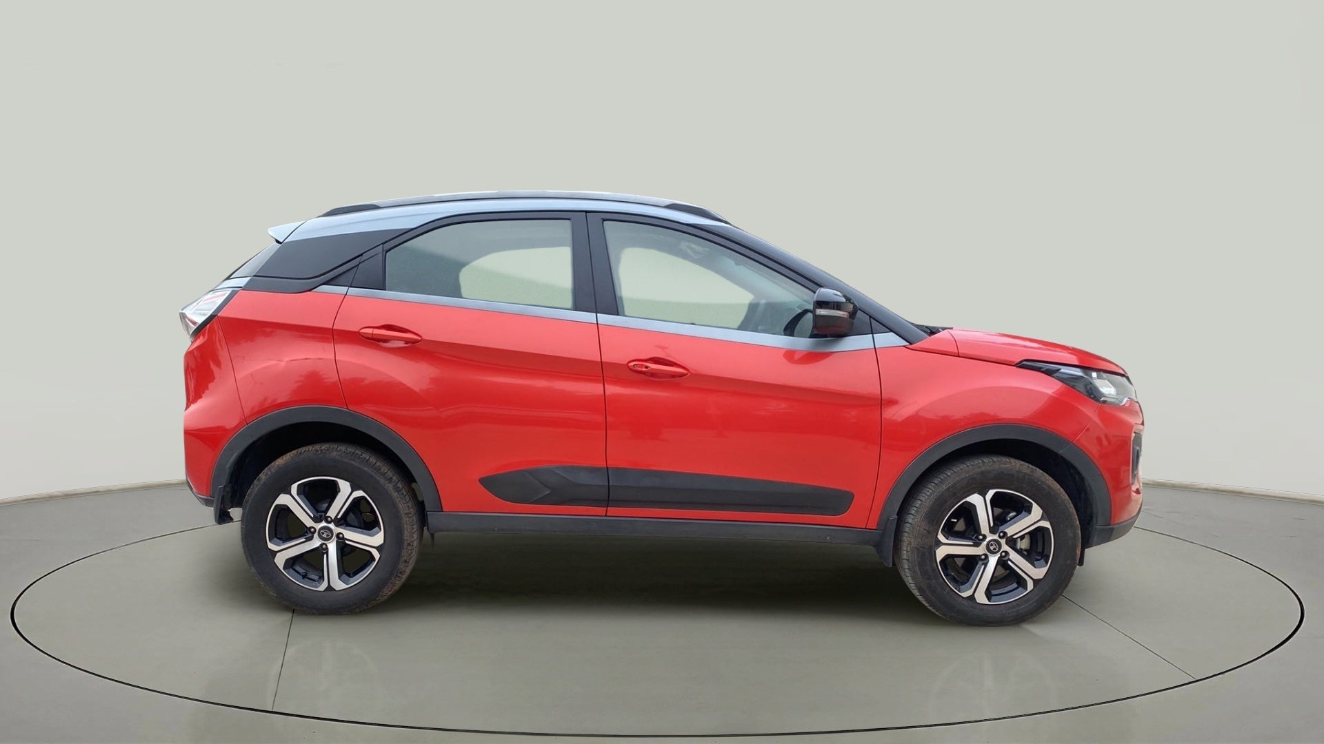 Side view of a Flame Red Tata Nexon 2017-2023