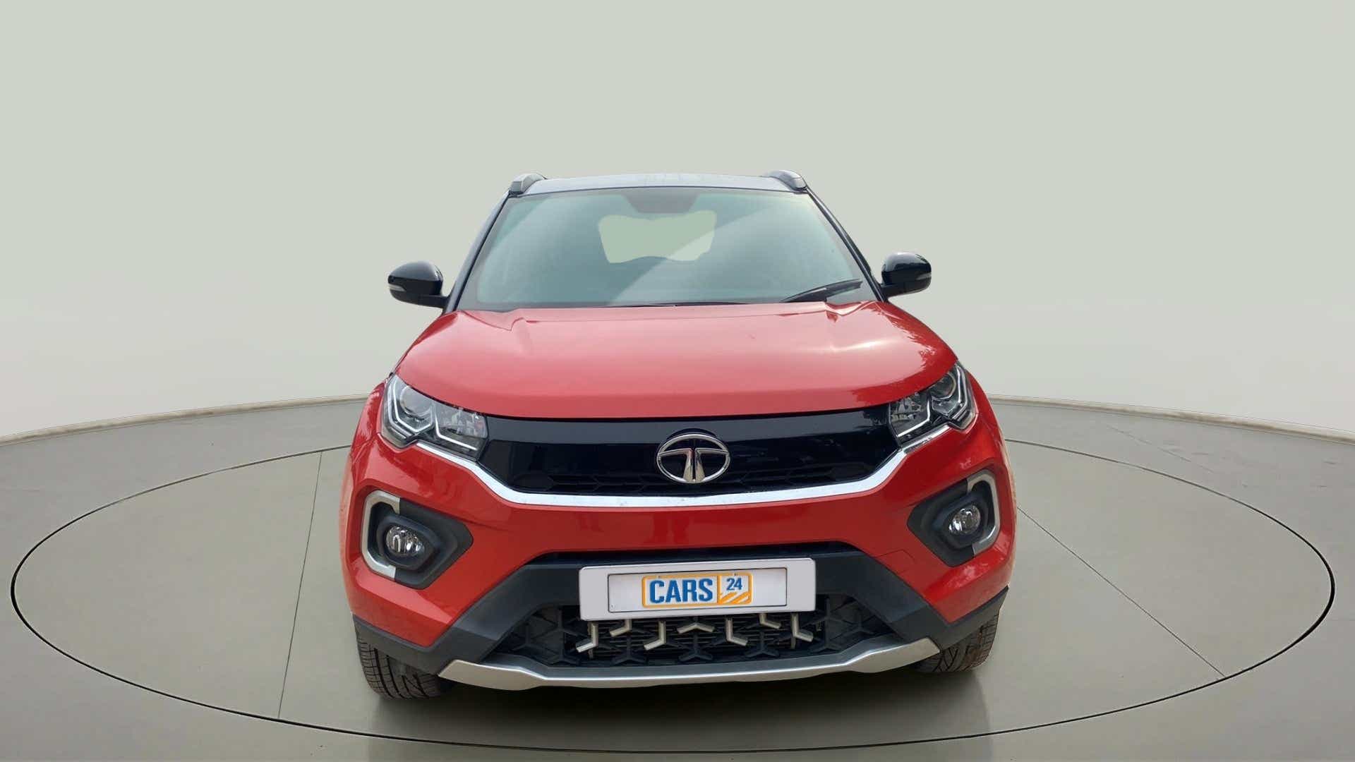 Front view of a flame red Tata Nexon 2017-2023