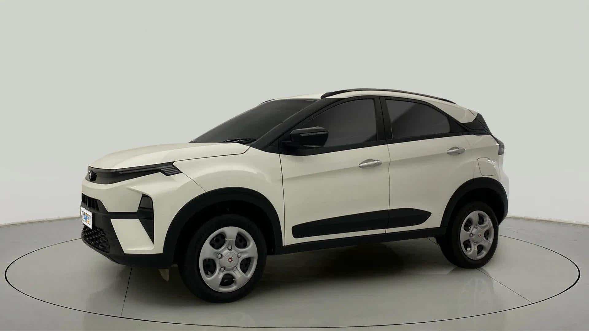 Side view of a calgary white Tata Nexon 2017-2023