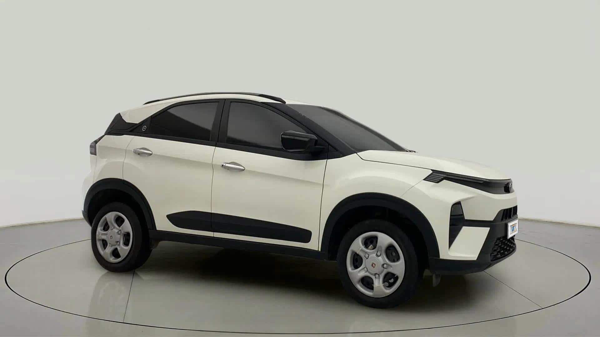 Side view of a calgary-white Tata Nexon 2017-2023