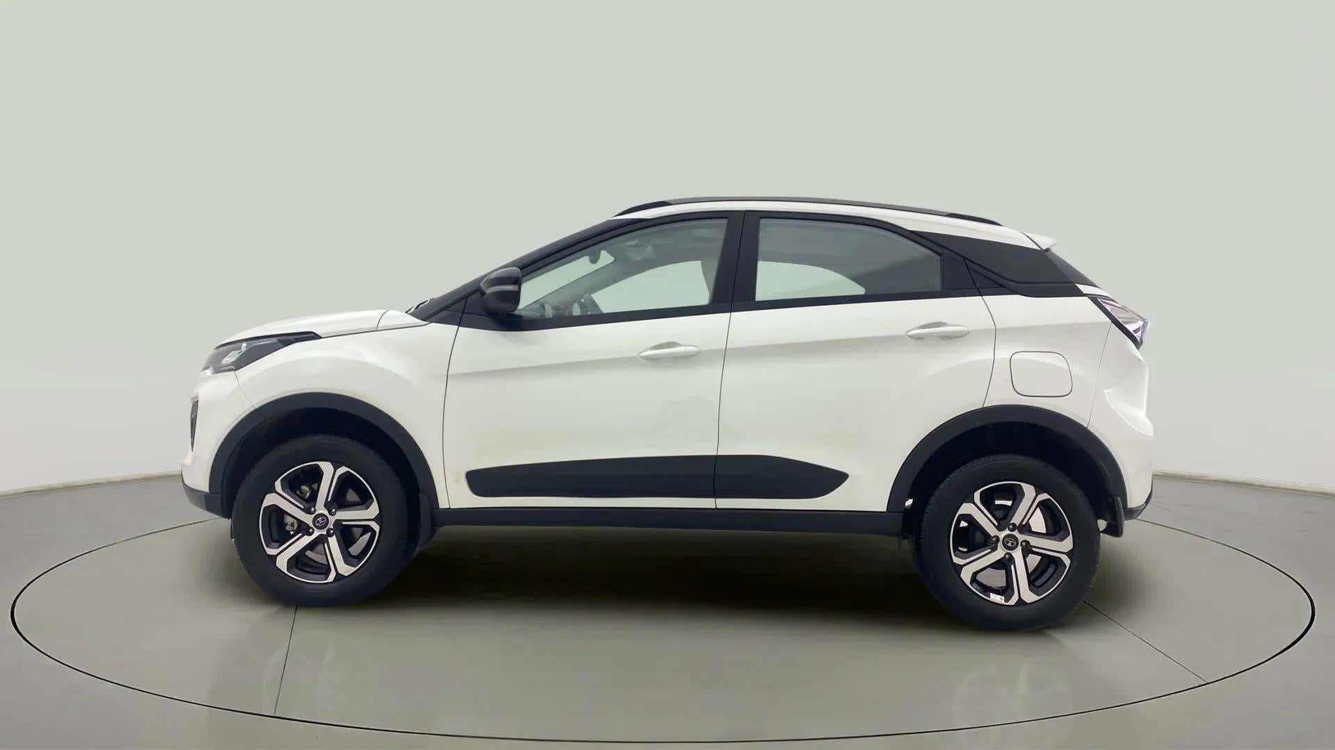 Side profile of a Calgary White Tata Nexon 2017-2023