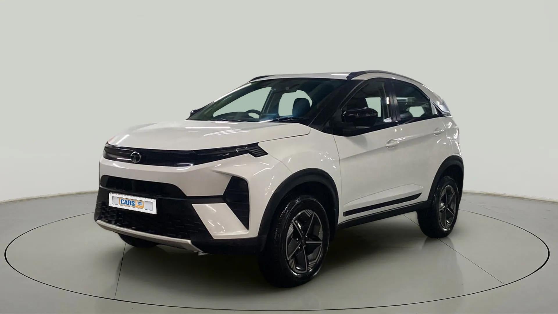 Front three-quarter view of a Calgary White Tata Nexon