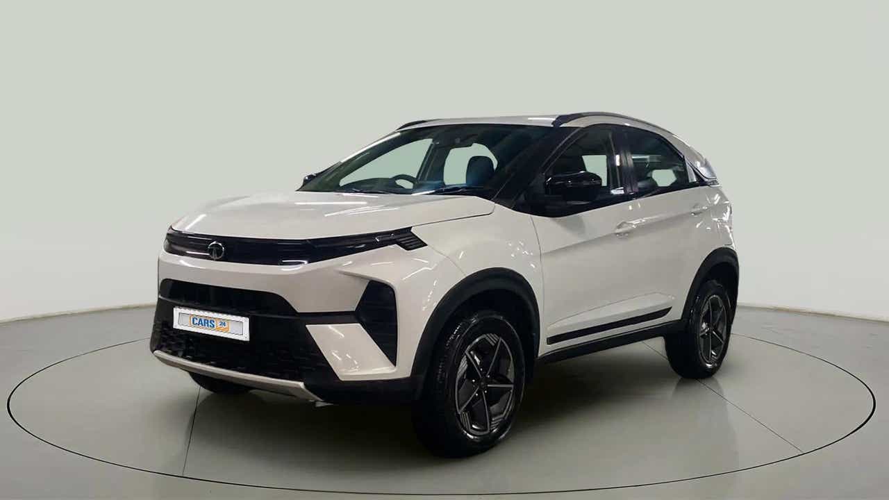 Front three-quarter view of a Calgary White Tata Nexon