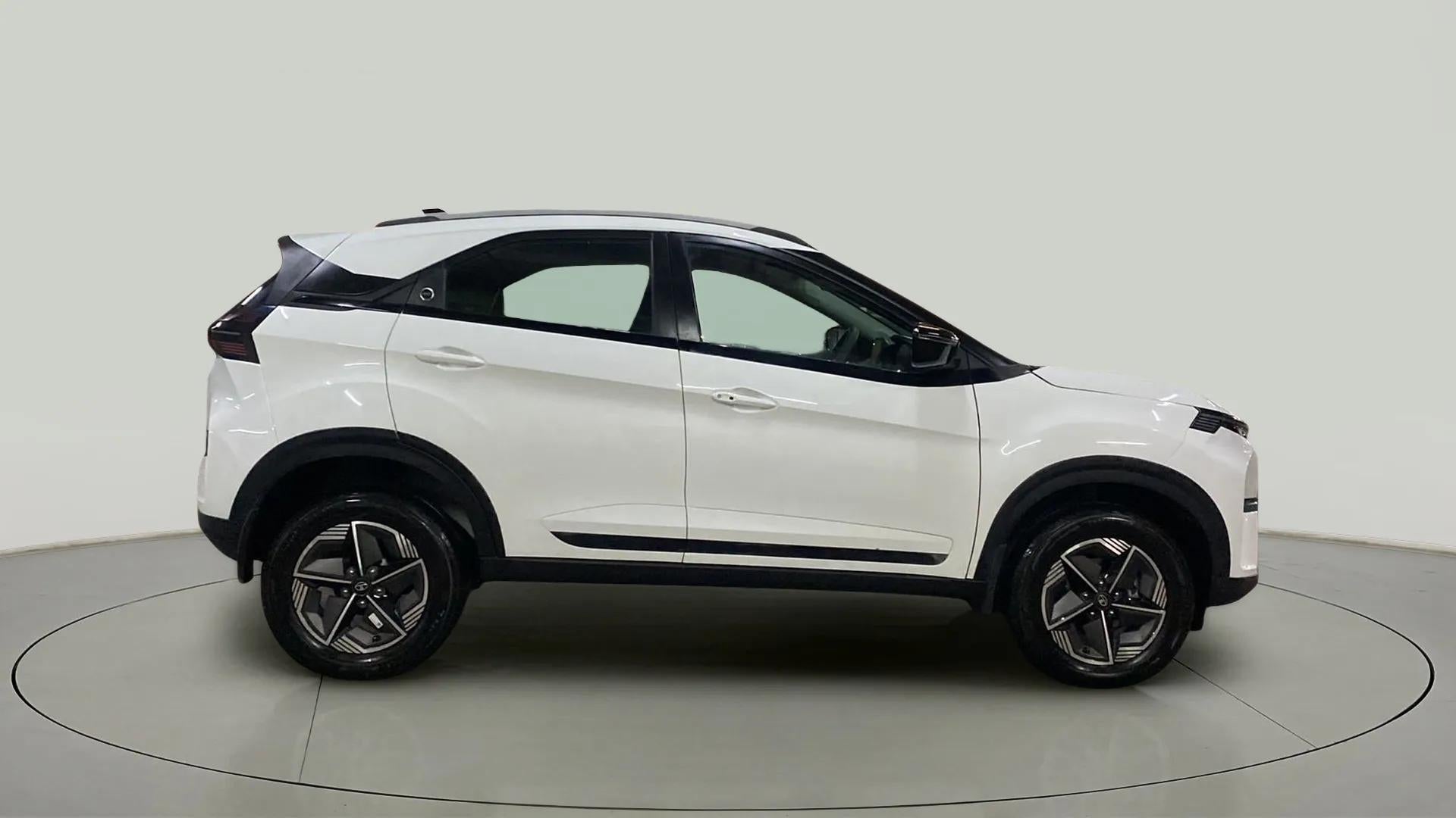 Side view of a Calgary White Tata Nexon