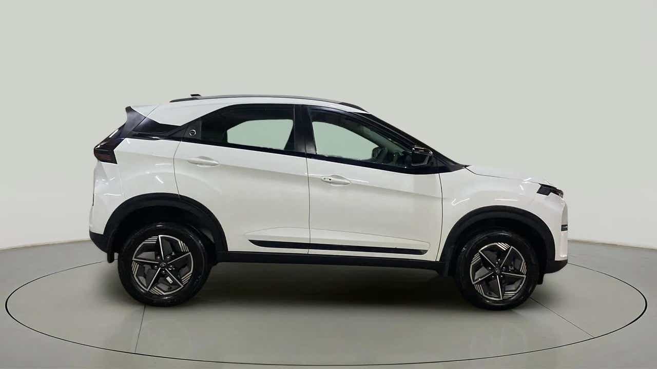 Side view of a Calgary White Tata Nexon