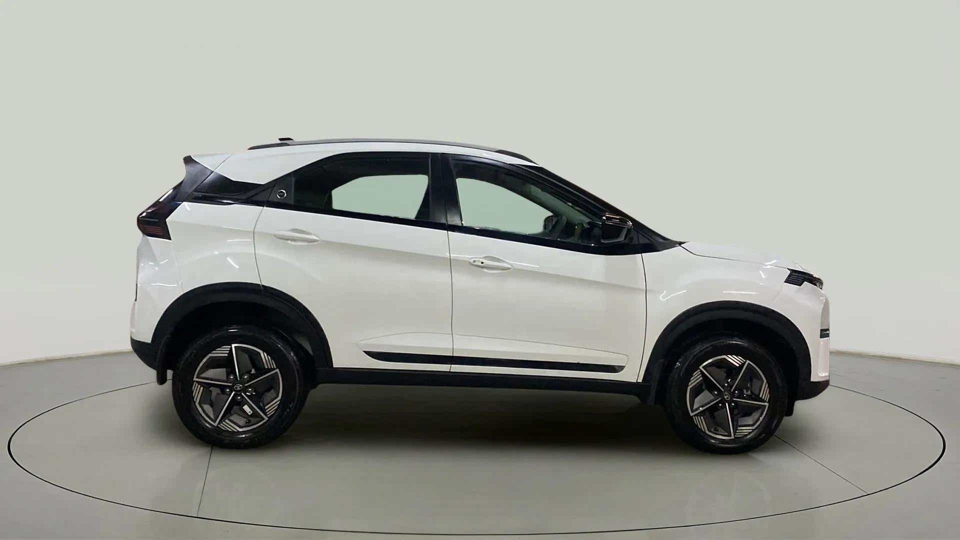 Side view of a Calgary White Tata Nexon