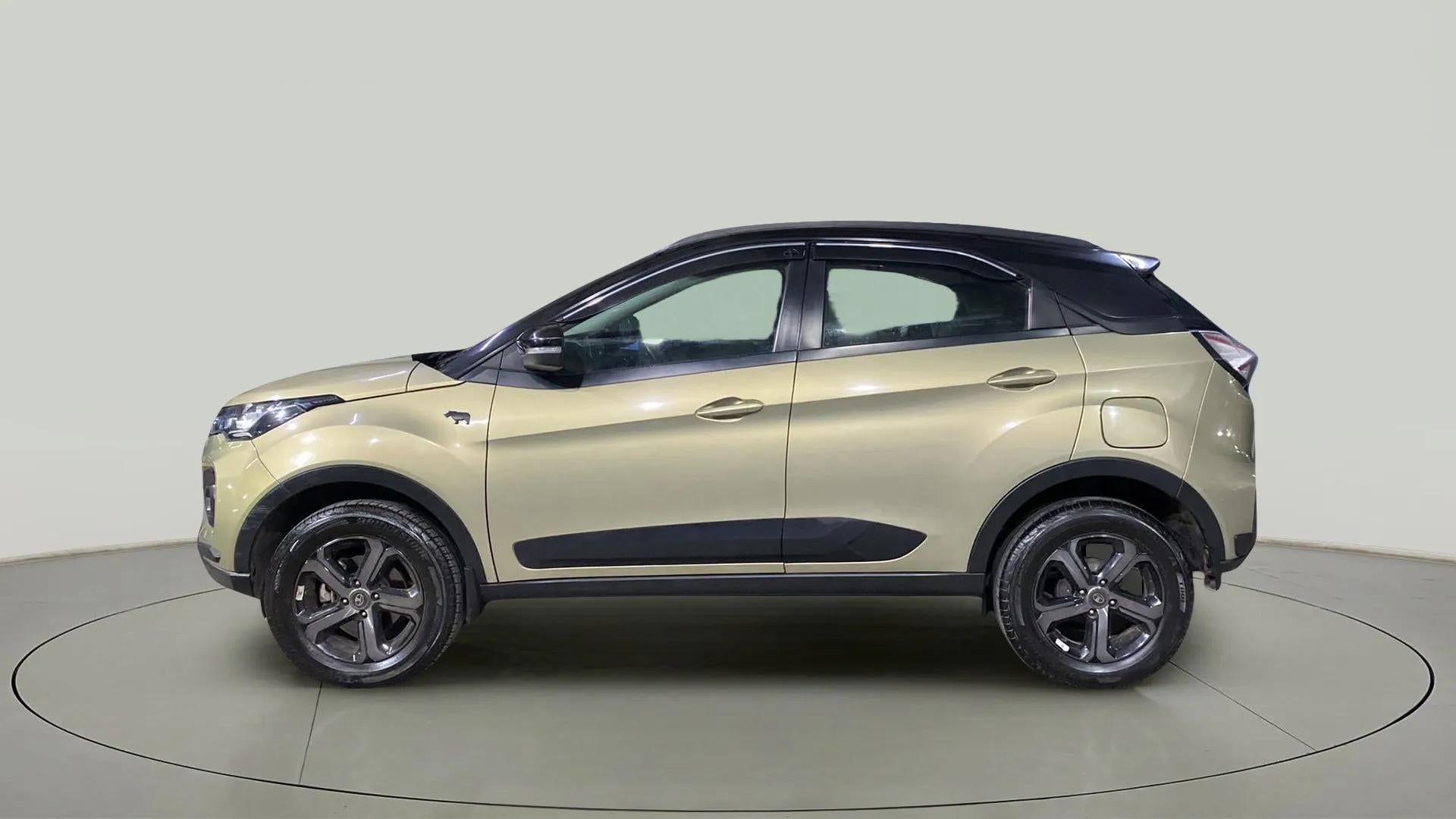 Side view of a Grassland Beige Tata Nexon 2017-2023