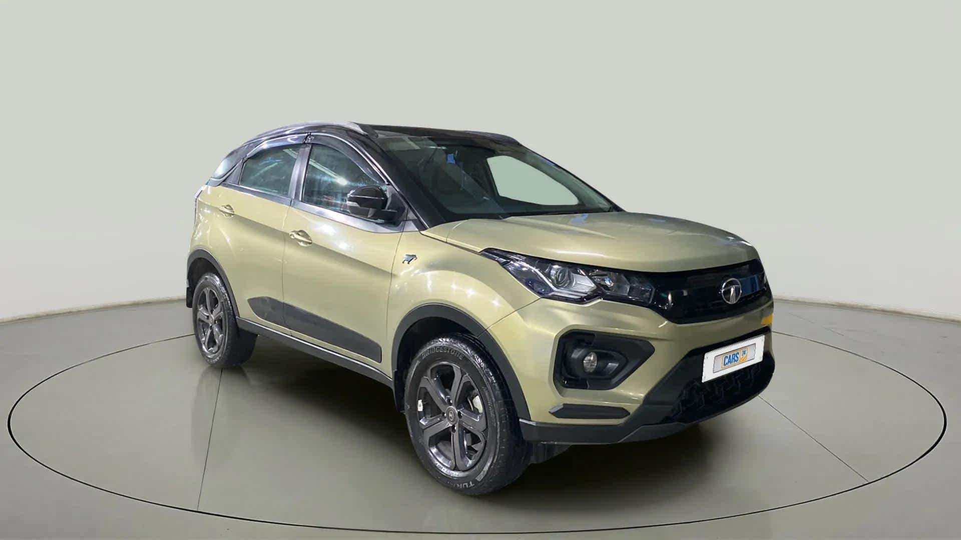 Front three-quarter view of a Grassland Beige Tata Nexon 2017-2023