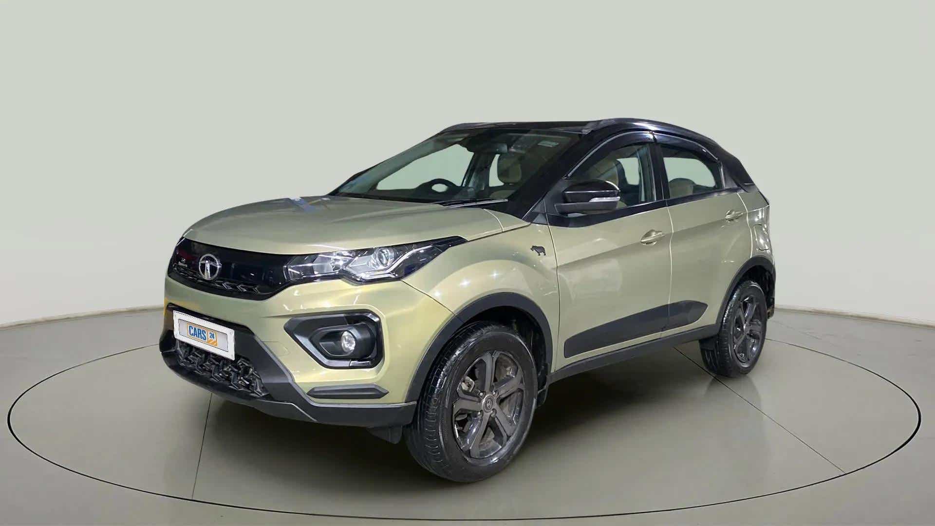 Front three-quarter view of a Grassland Beige Tata Nexon 2017-2023