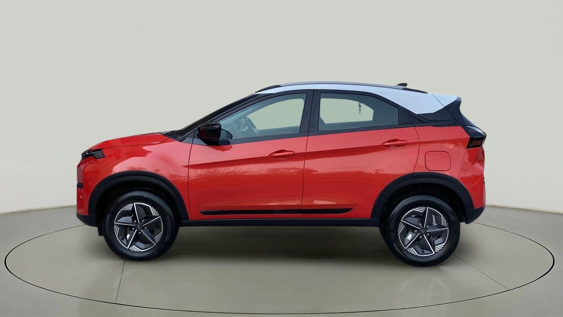 Side view of a flame red Tata Nexon 2017-2023