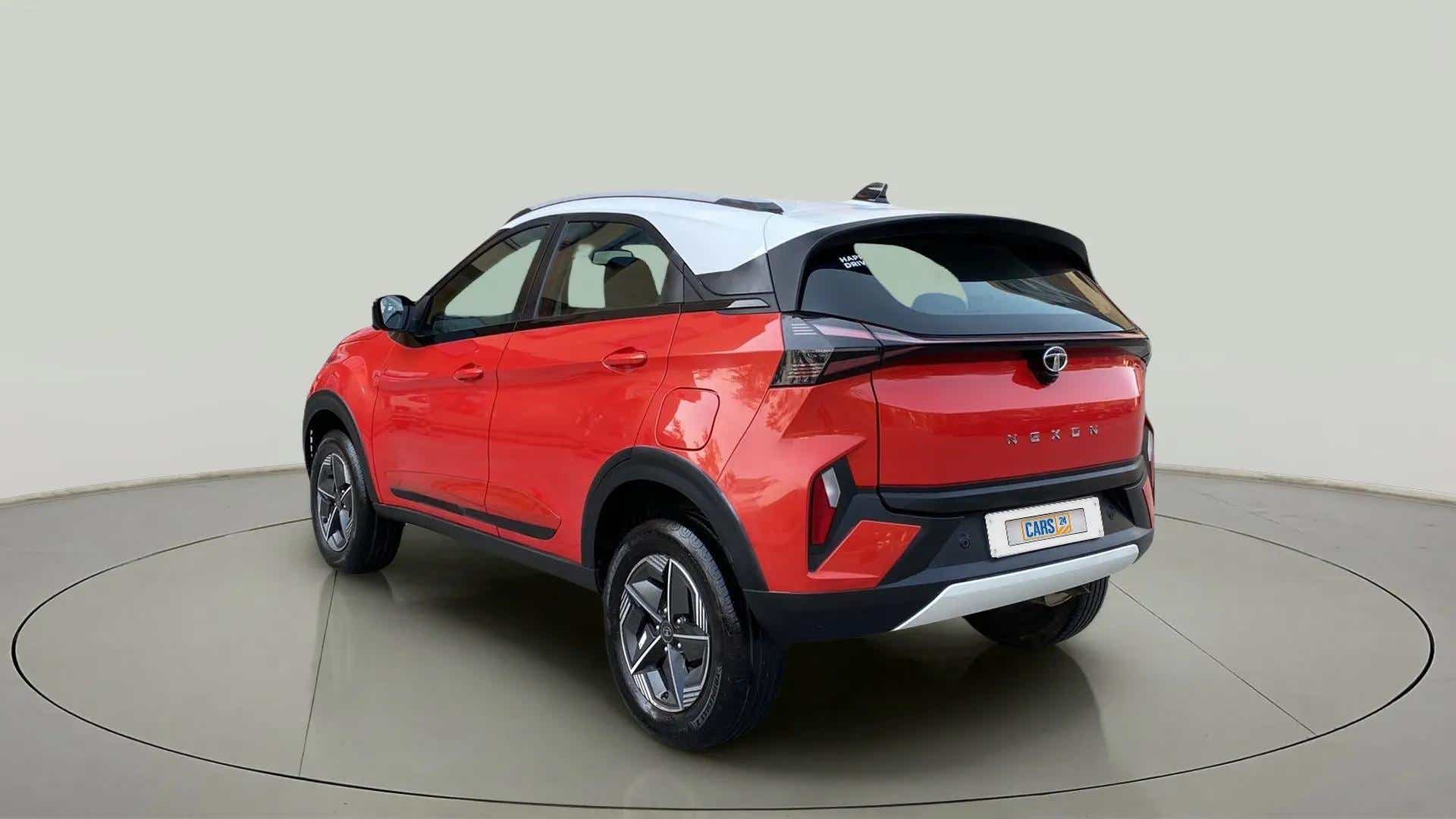 Rear three-quarter view of a Flame Red Tata Nexon 2017-2023