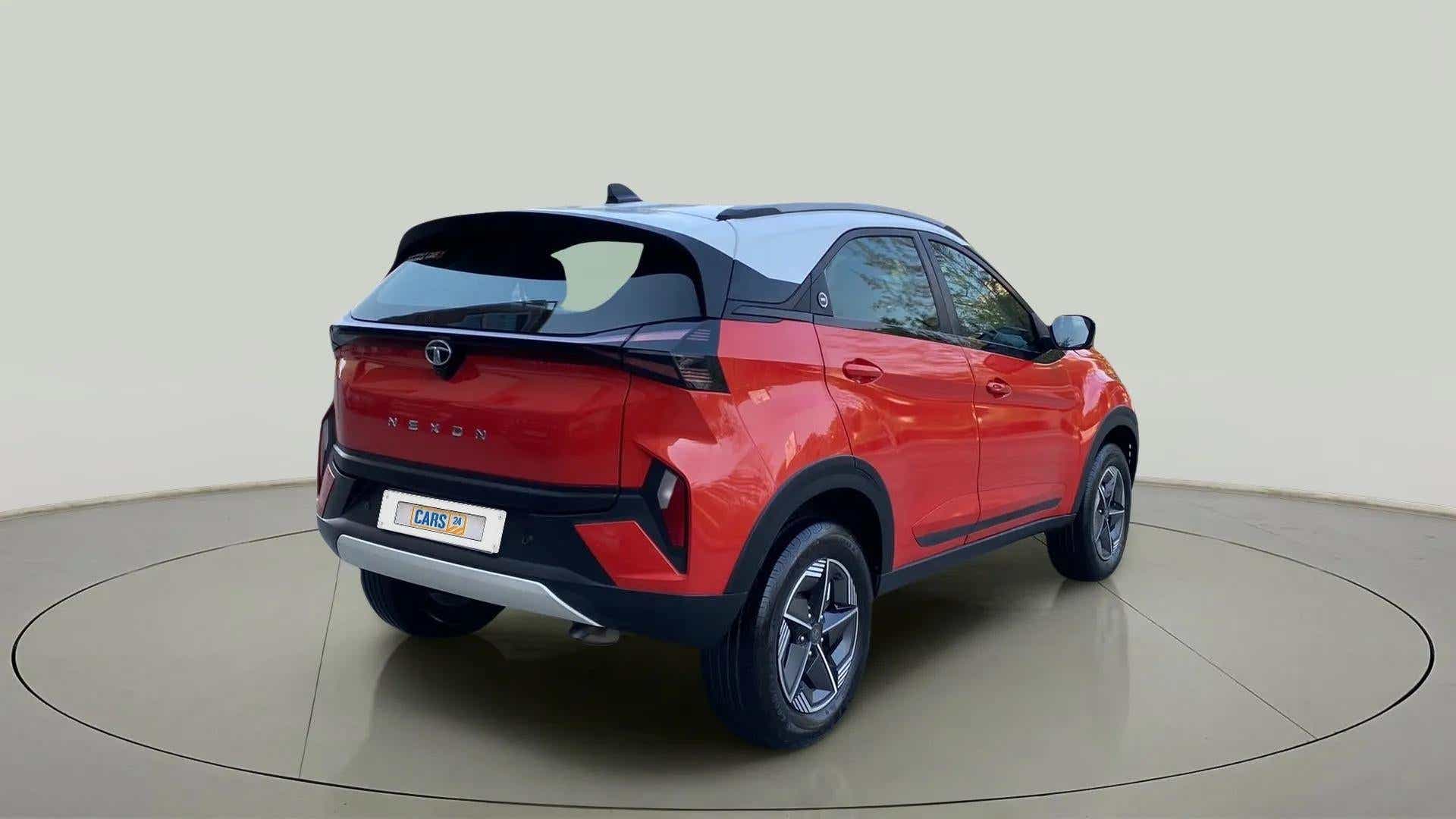 Rear three-quarter view of a Flame Red Tata Nexon 2017-2023