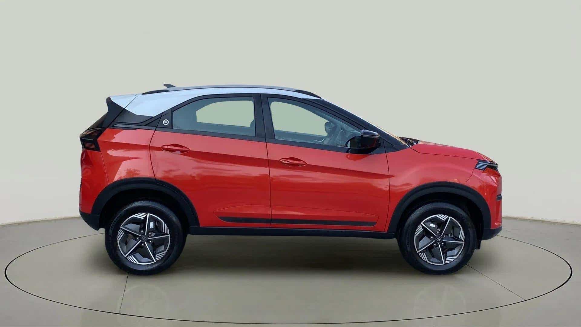 Side view of a Flame Red Tata Nexon 2017-2023