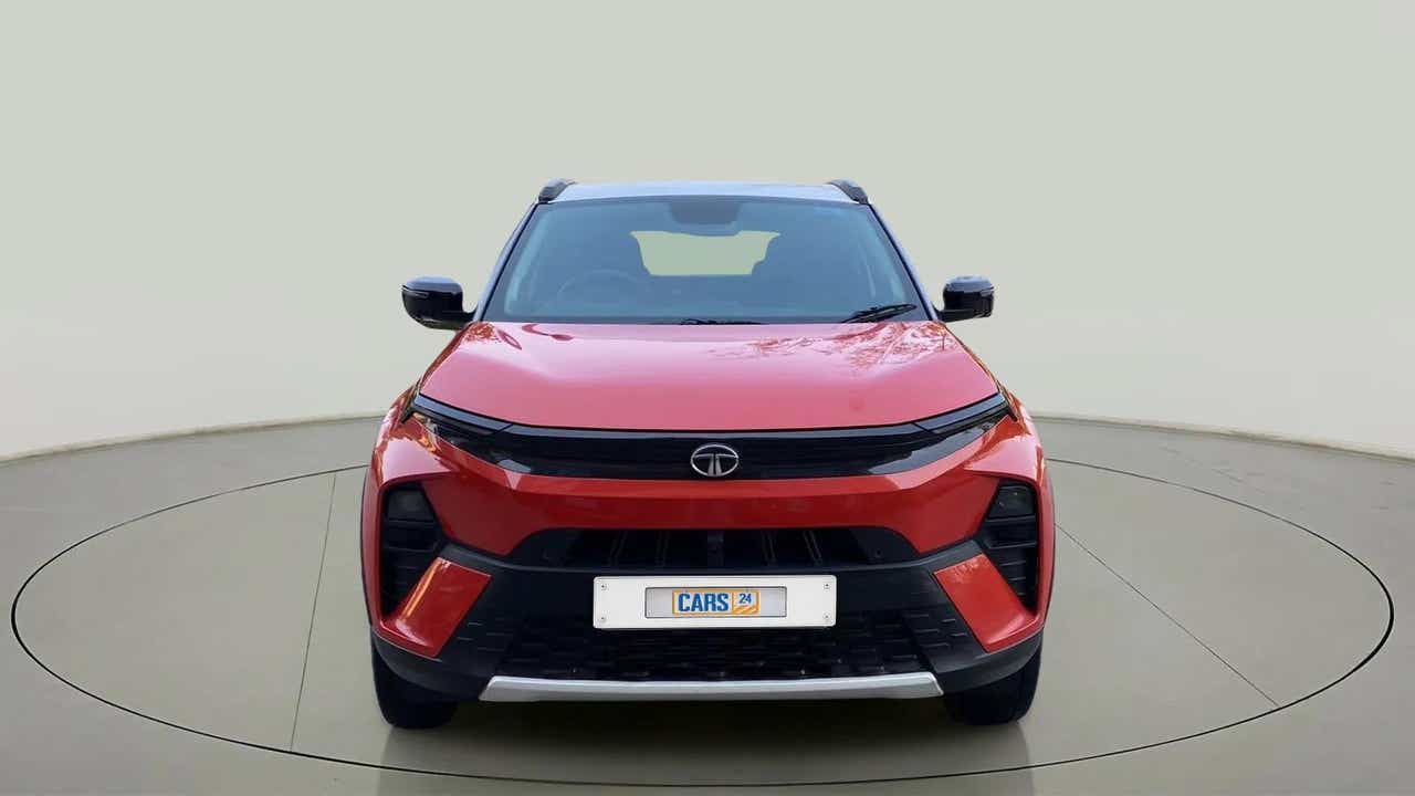 Front view of a flame red Tata Nexon 2017-2023