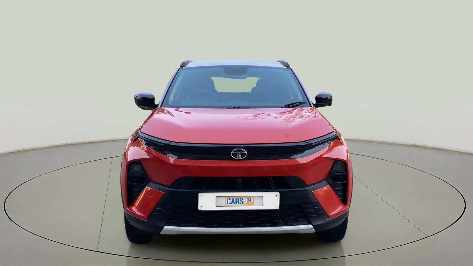 Front view of a flame red Tata Nexon 2017-2023